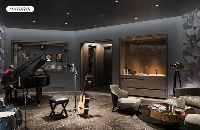 a view of a kitchen with a large counter space and wooden floor