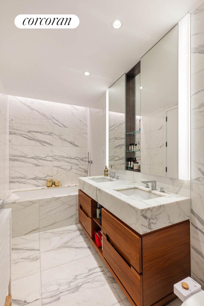 30 Riverside Boulevard, Unit 22F Manhattan, NY 10069 - Photo 4 of 16 a bathroom with a sink and a bathtub