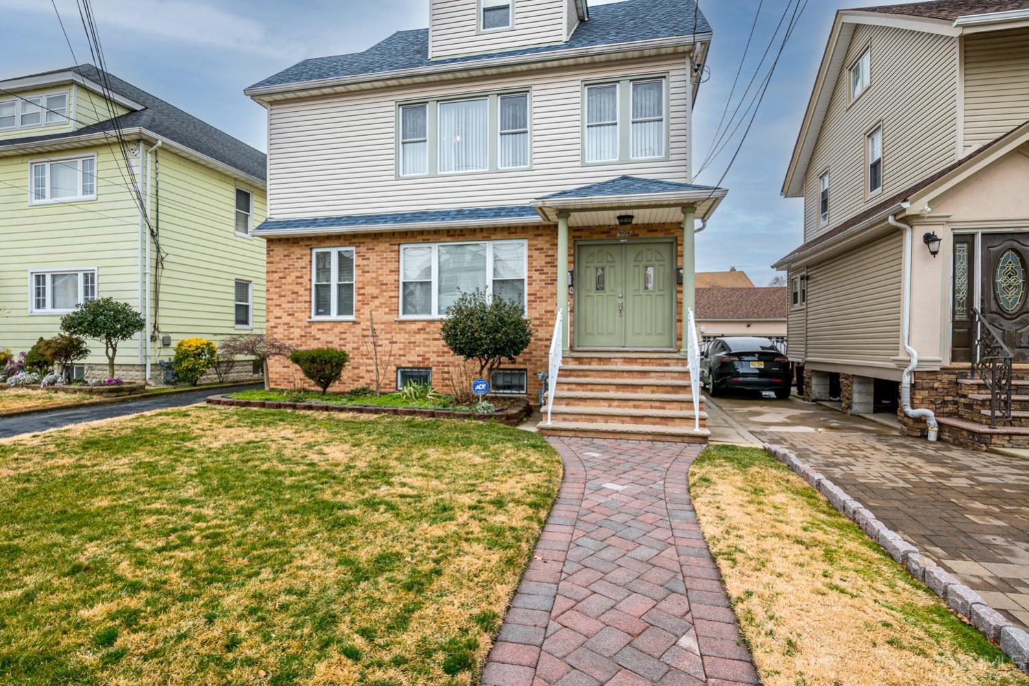 906-908 Kilsyth Road Elizabeth, NJ 07208 - Photo 2 of 50 a view of a house with swimming pool and sitting area
