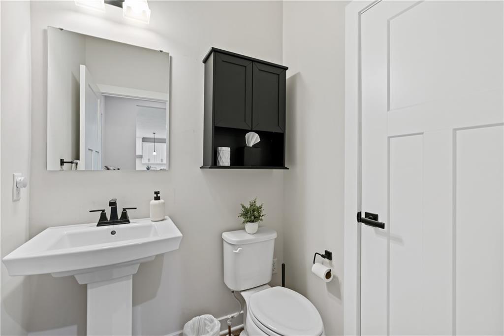114 Marketplace Avenue Coraopolis, PA 15108 - Photo 13 of 32 a bathroom with a sink toilet and mirror