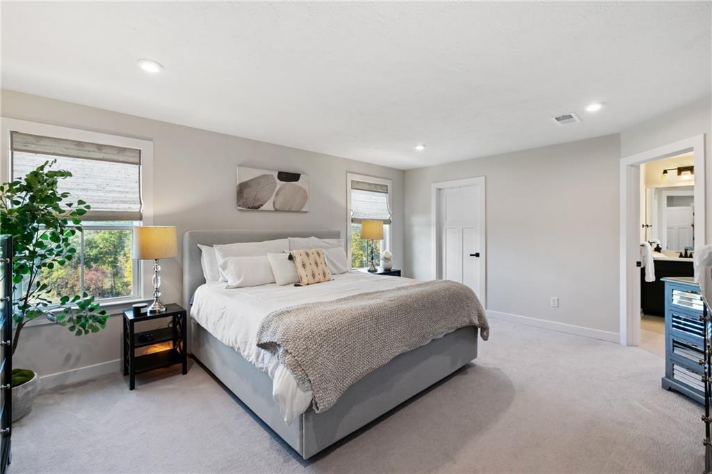 114 Marketplace Avenue Coraopolis, PA 15108 - Photo 17 of 32 a bedroom with a bed and a potted plant