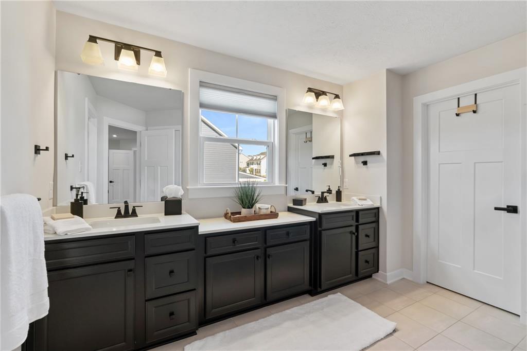 114 Marketplace Avenue Coraopolis, PA 15108 - Photo 19 of 32 a bathroom with a double vanity sink and mirror