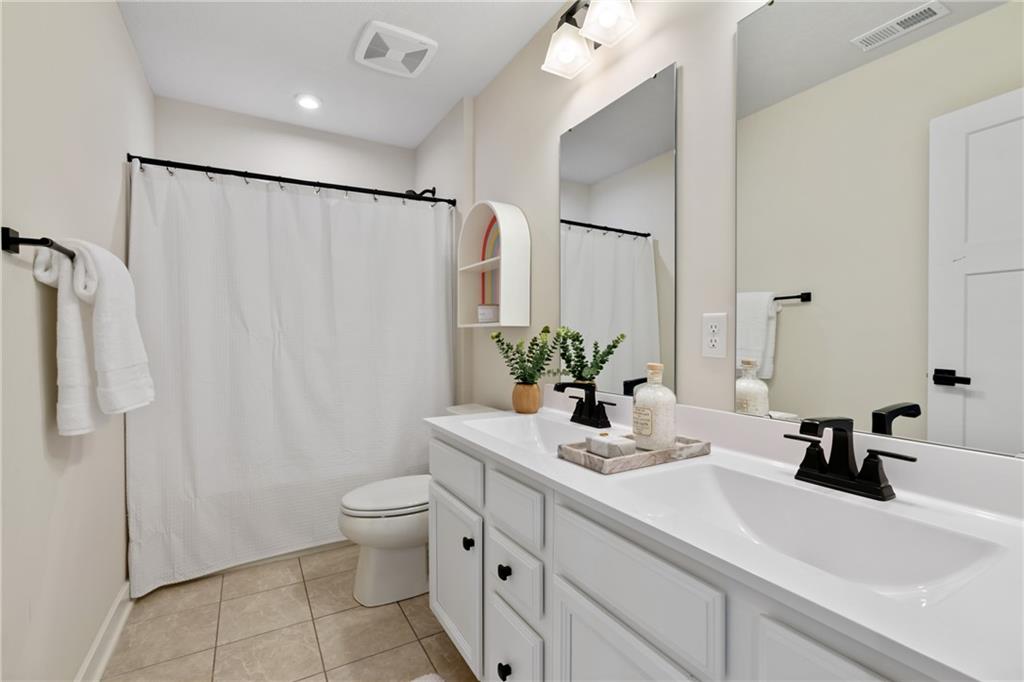 114 Marketplace Avenue Coraopolis, PA 15108 - Photo 23 of 32 a bathroom with a sink a toilet and shower