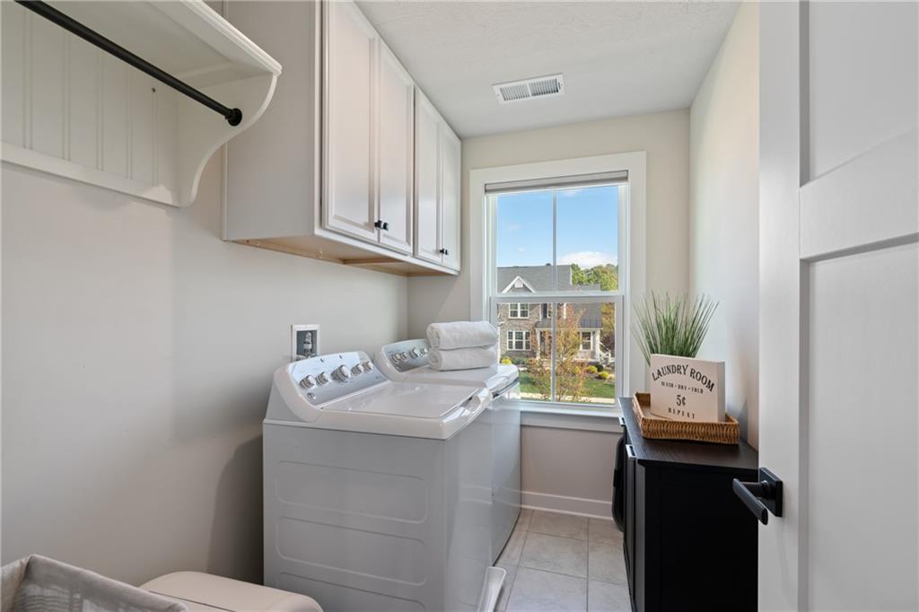 114 Marketplace Avenue Coraopolis, PA 15108 - Photo 25 of 32 a utility room with a sink a washer and dryer