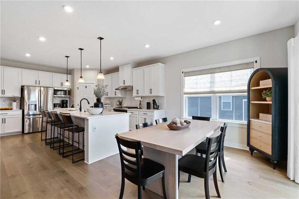 114 Marketplace Avenue Coraopolis, PA 15108 - Photo 9 of 32 a kitchen with a dining table chairs and refrigerator
