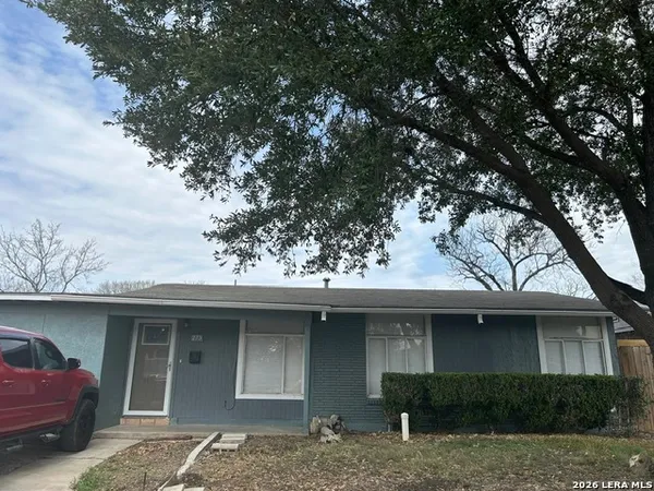 a house with trees in the background