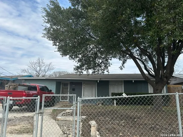 front view of a house with a tree