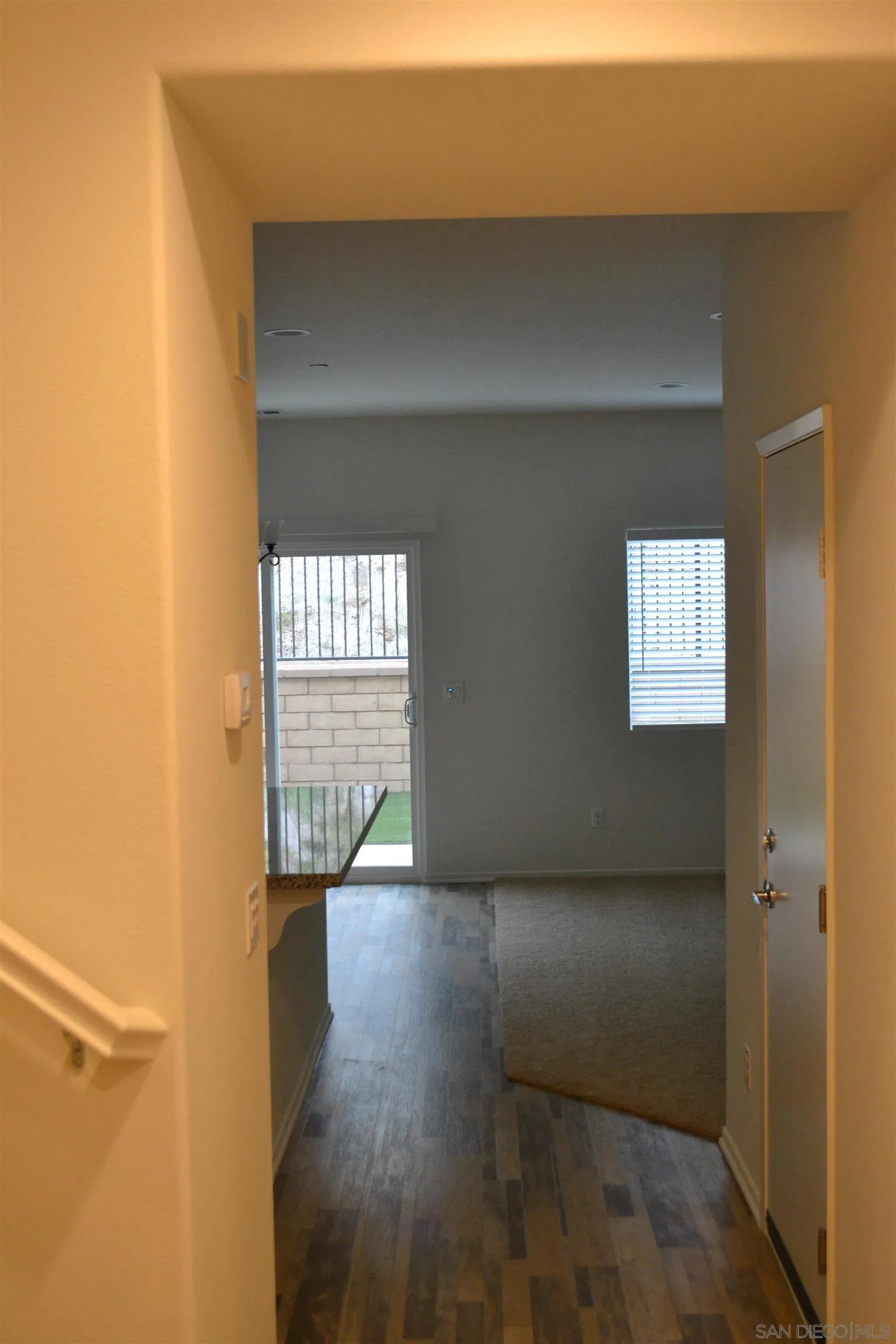 35329 White Camarillo Lane Fallbrook, CA 92028 - Photo 9 of 16 a view of an empty room with wooden floor and a window