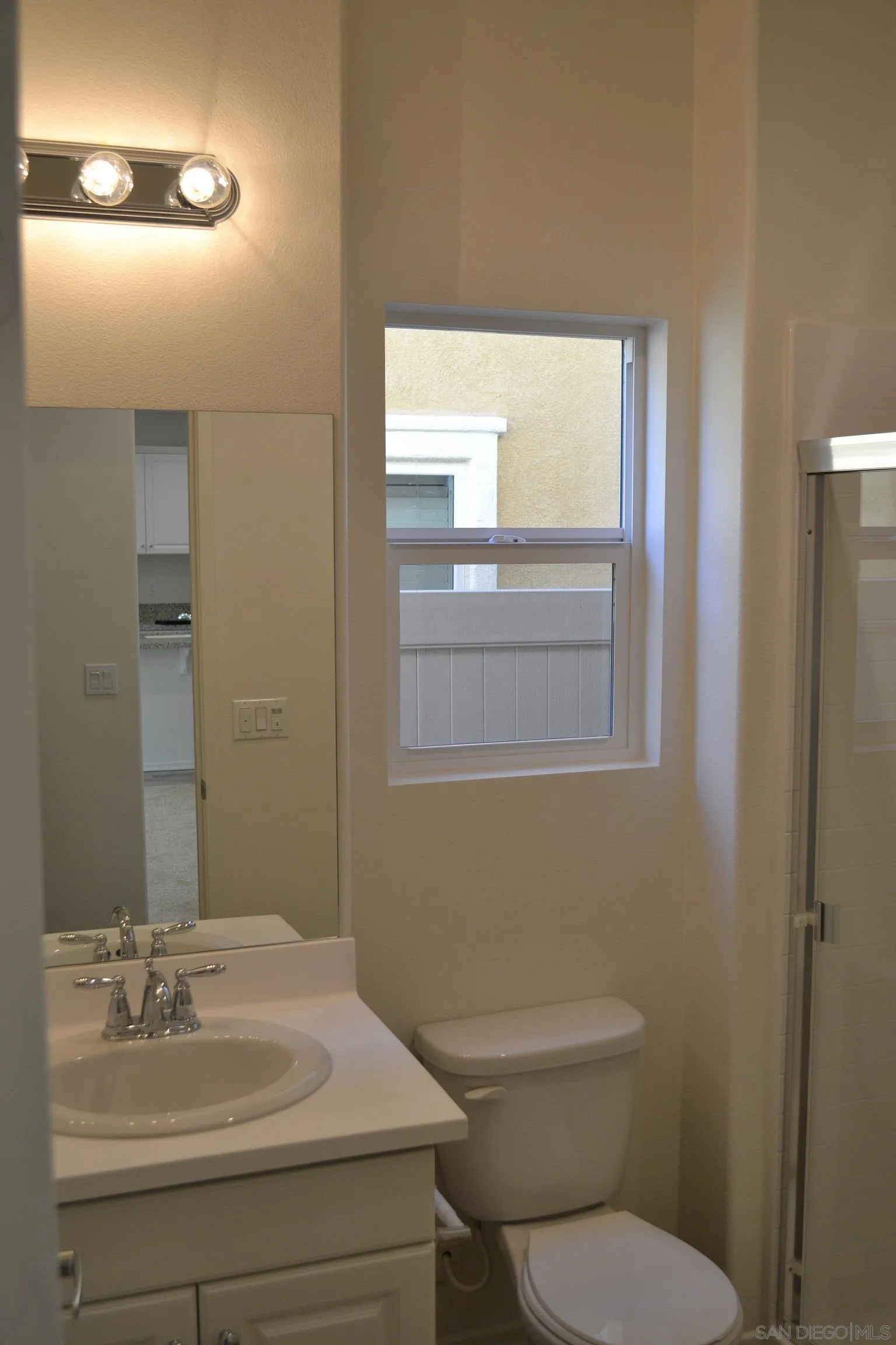 35329 White Camarillo Lane Fallbrook, CA 92028 - Photo 10 of 16 a bathroom with a sink a toilet and mirror