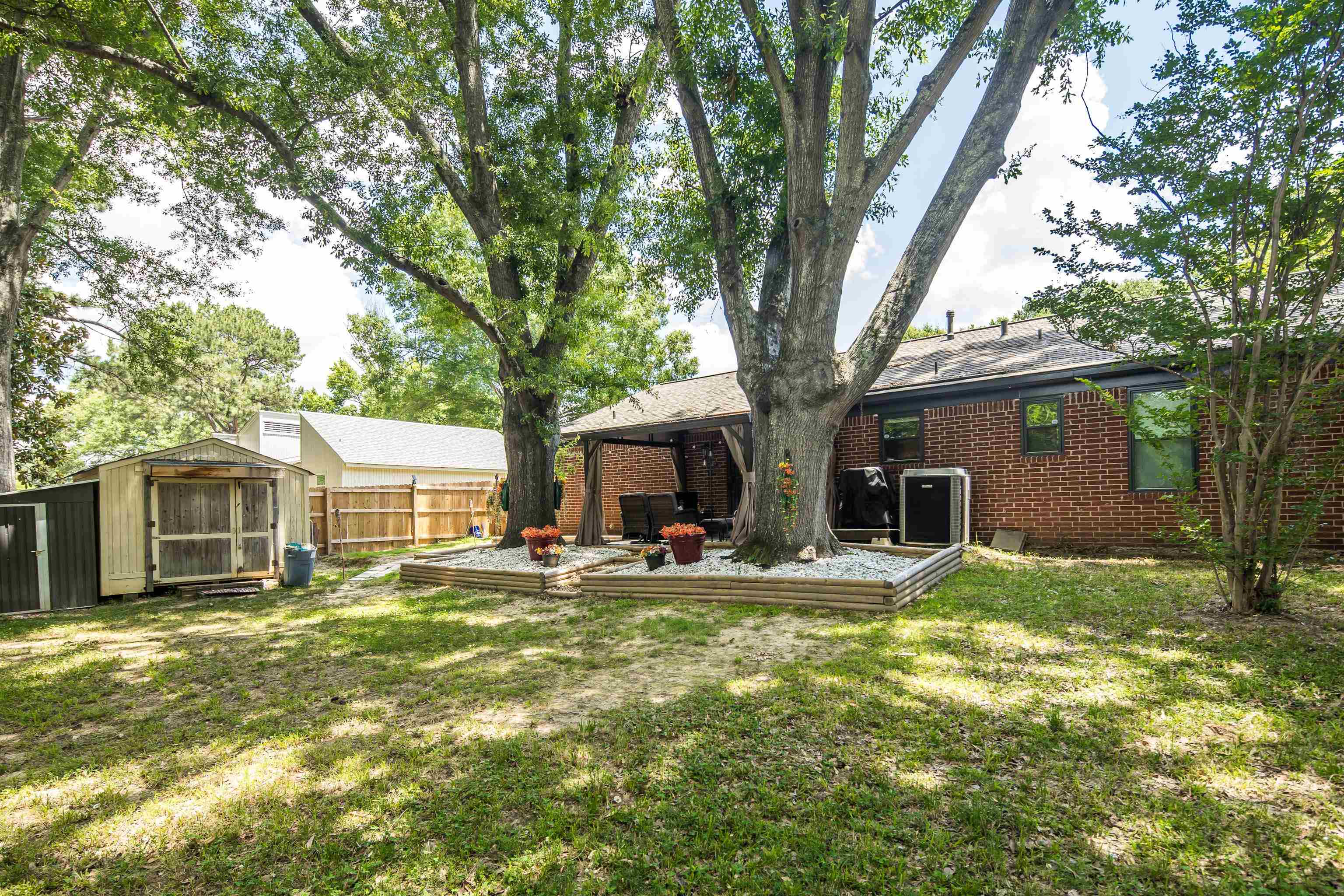 1137 Greenview Road Collierville, TN 38017 - Photo 32 of 35 a house view with a sitting space and garden