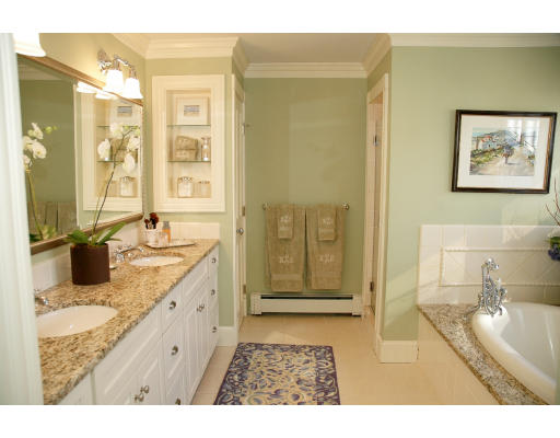 138 Partridge Lane Concord, MA 01742 - Photo 11 of 19 a bathroom with a granite countertop sink a mirror a bathtub and a shower