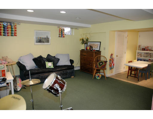 138 Partridge Lane Concord, MA 01742 - Photo 17 of 19 a living room with furniture and a gym