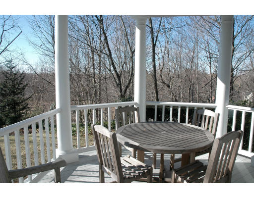138 Partridge Lane Concord, MA 01742 - Photo 19 of 19 a view of a wooden bench and table