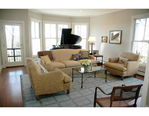 138 Partridge Lane Concord, MA 01742 - Photo 6 of 19 a living room with furniture and a flat screen tv