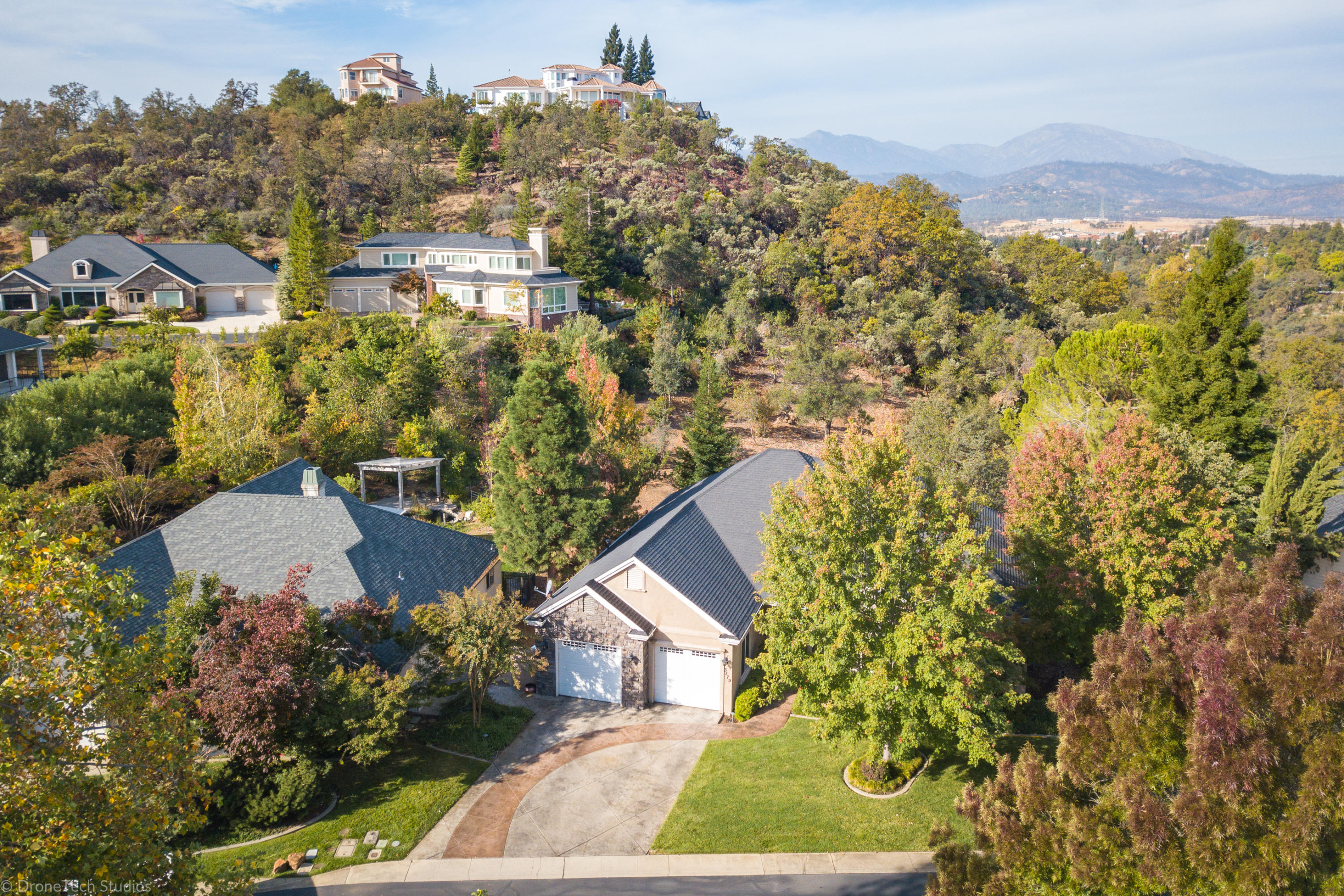 3179 Pinot Path Redding, CA 96001 - Photo 57 of 60 a view of a house with a yard and garden
