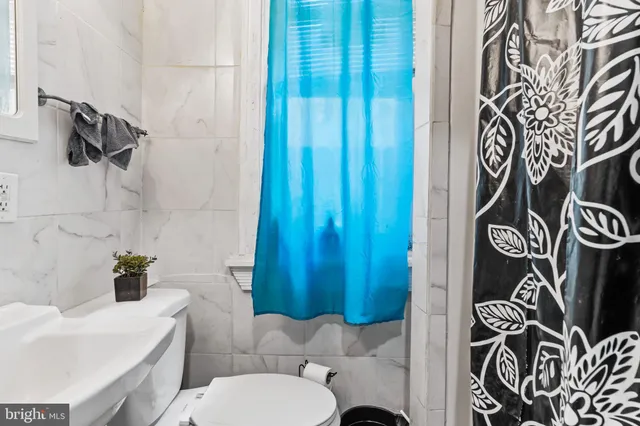 a bathroom with a toilet and sink