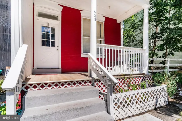 a view of a bench in front of house
