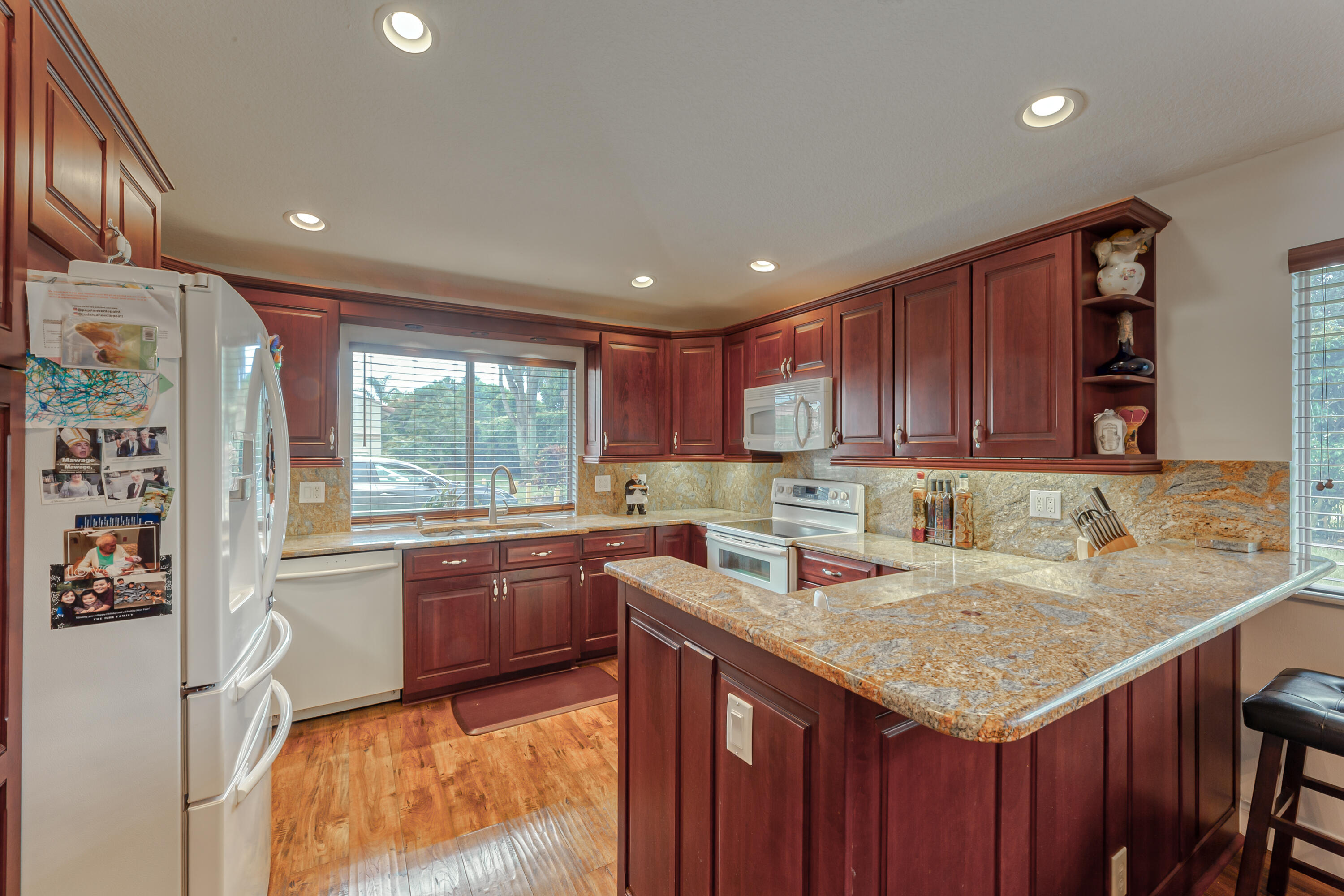 6816 Via Regina Boca Raton, FL 33433 - Photo 8 of 36 a kitchen with a stove sink and cabinets