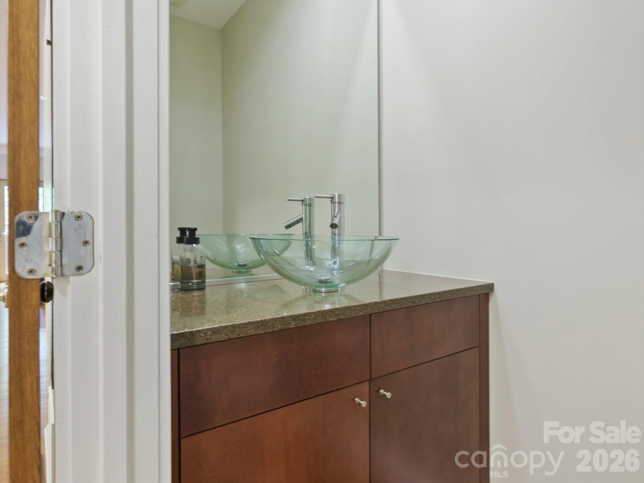 420 Queens Road Charlotte, NC 28207 - Photo 19 of 35 a bathroom with a granite countertop sink and a mirror