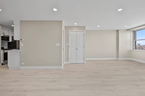 a bathroom with a shower sink and mirror