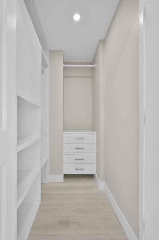 151 Tremont Street, Unit 18M Boston, MA 02111 - Photo 20 of 35 a view of an empty walk in closet