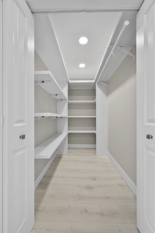 151 Tremont Street, Unit 18M Boston, MA 02111 - Photo 21 of 35 a view of walk in closet with empty racks