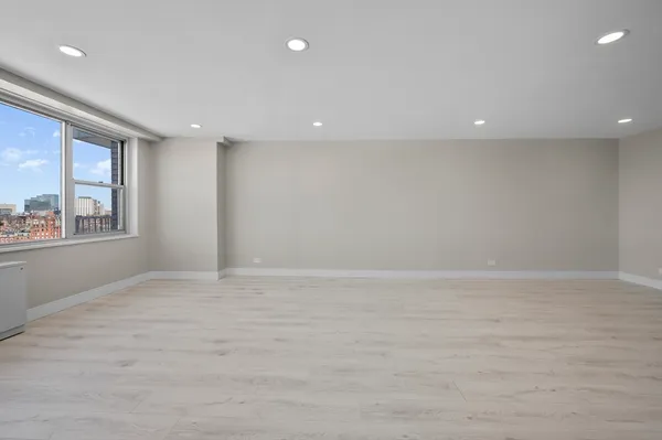a kitchen with stainless steel appliances granite countertop a stove and a microwave with granite countertops