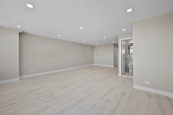 a bedroom with a bed and a television