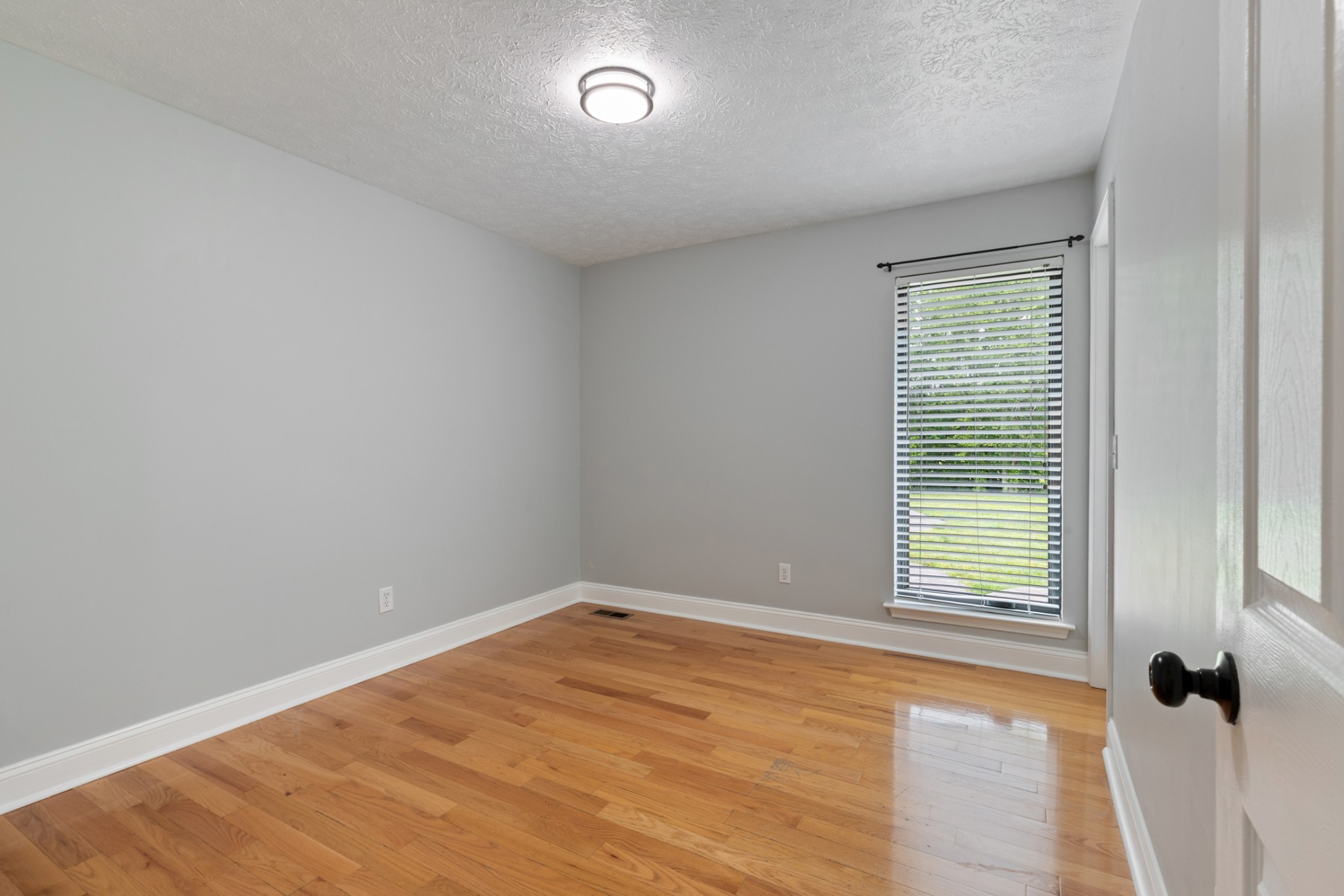 3791 Sylvia Road Dickson, TN 37055 - Photo 27 of 82 wooden floor in an empty room with a window