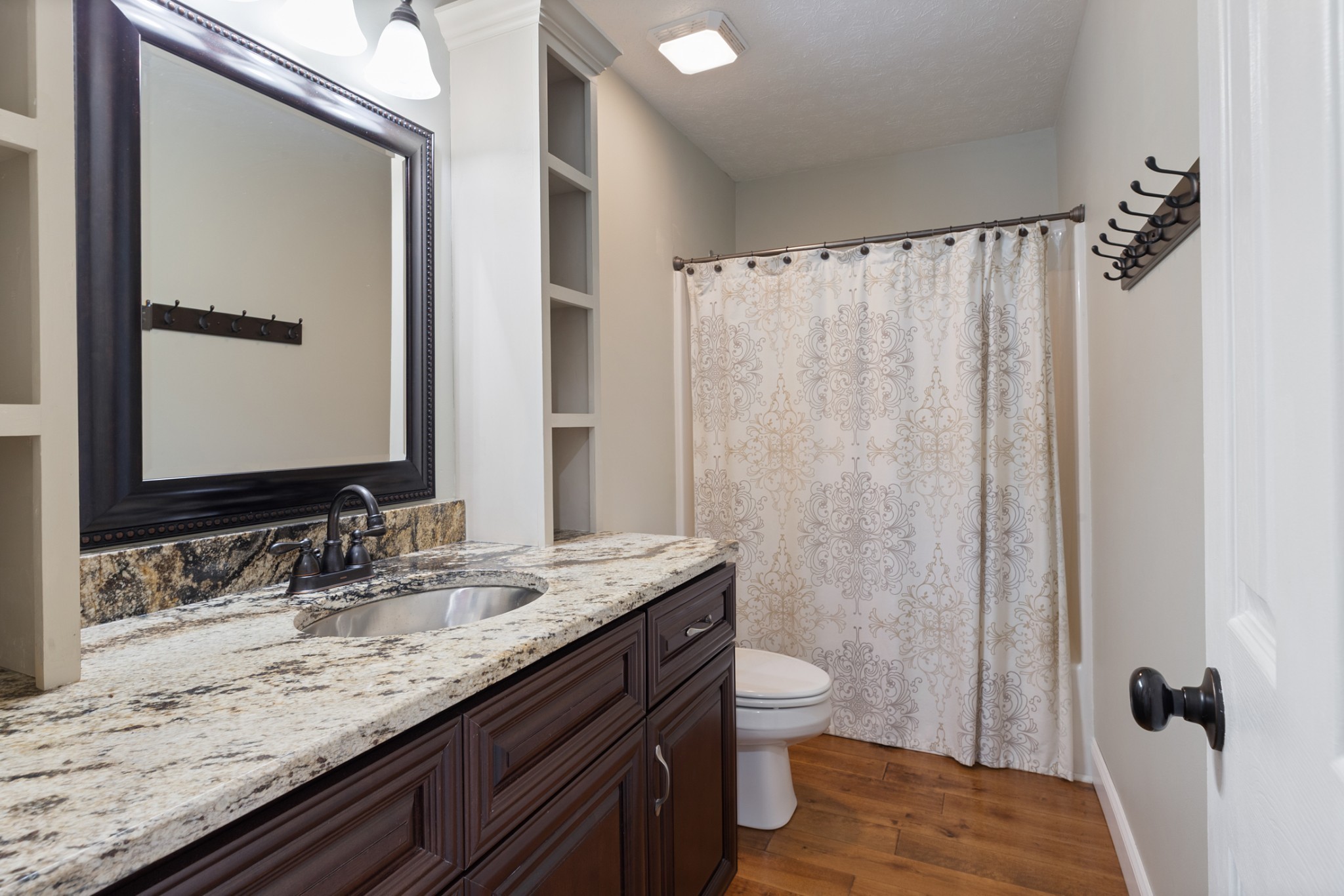 3791 Sylvia Road Dickson, TN 37055 - Photo 29 of 82 a bathroom with a granite countertop sink toilet and shower