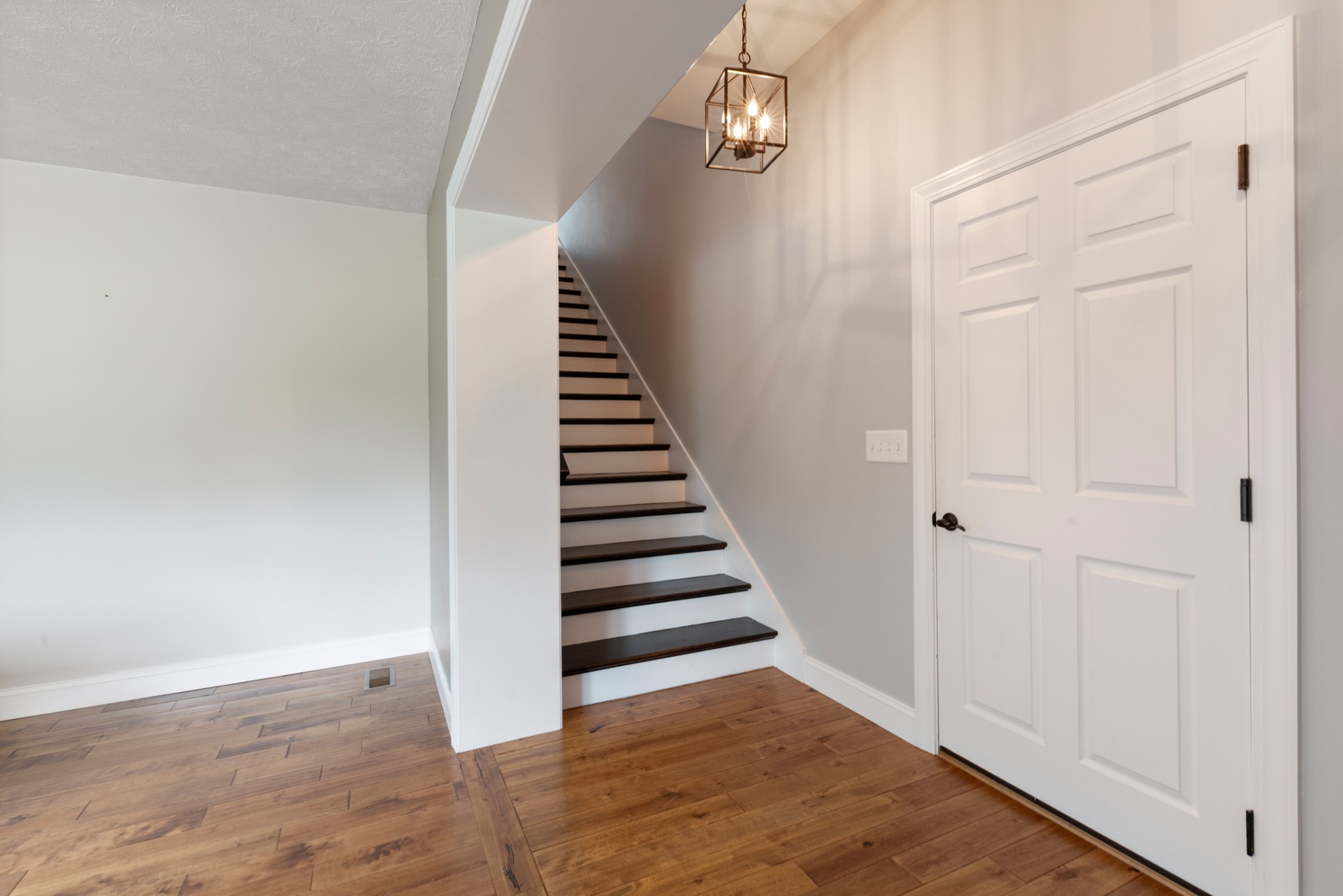 3791 Sylvia Road Dickson, TN 37055 - Photo 35 of 82 a view of a hallway with wooden floor and entryway