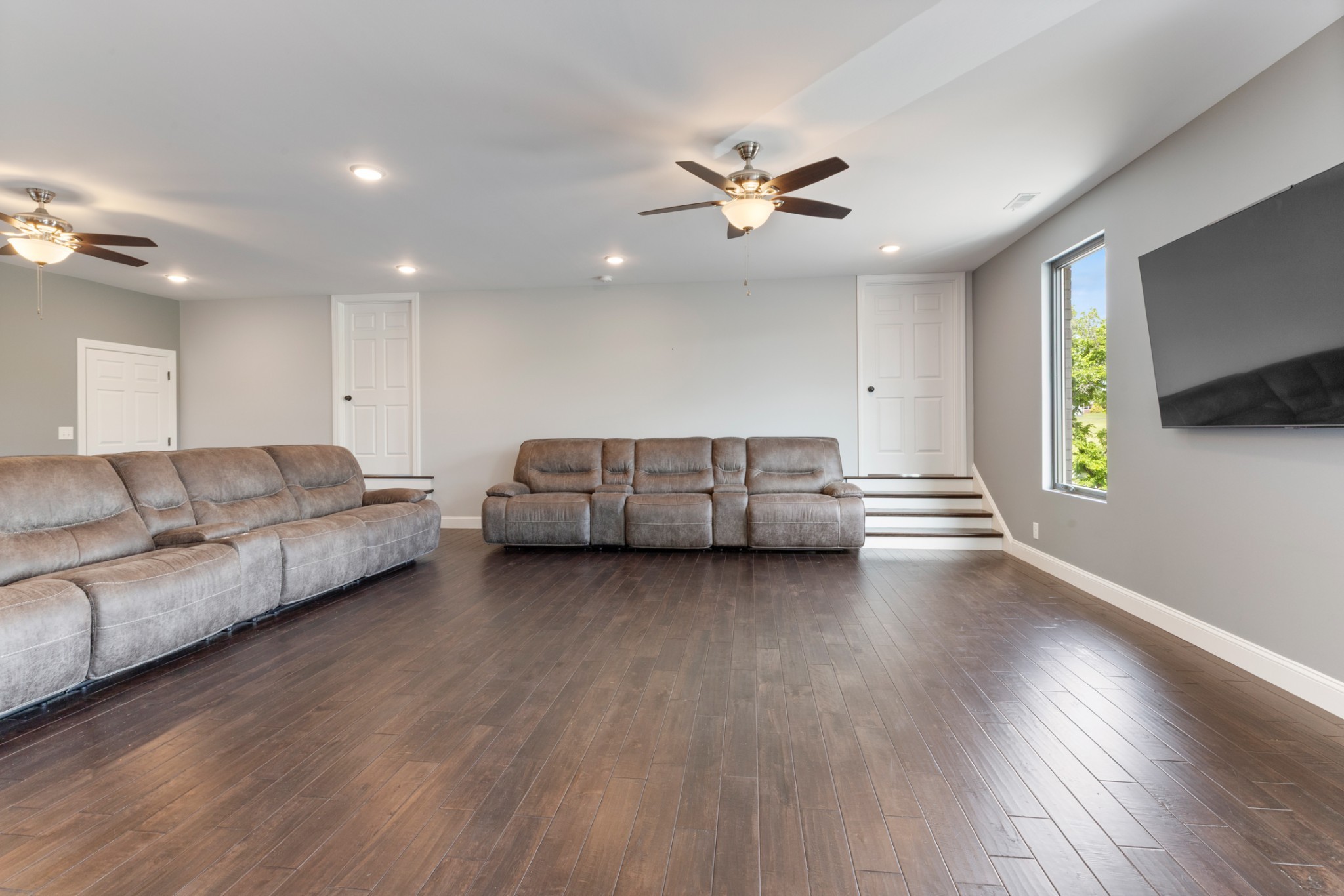3791 Sylvia Road Dickson, TN 37055 - Photo 44 of 82 a living room with couches and a flat screen tv with wooden floor
