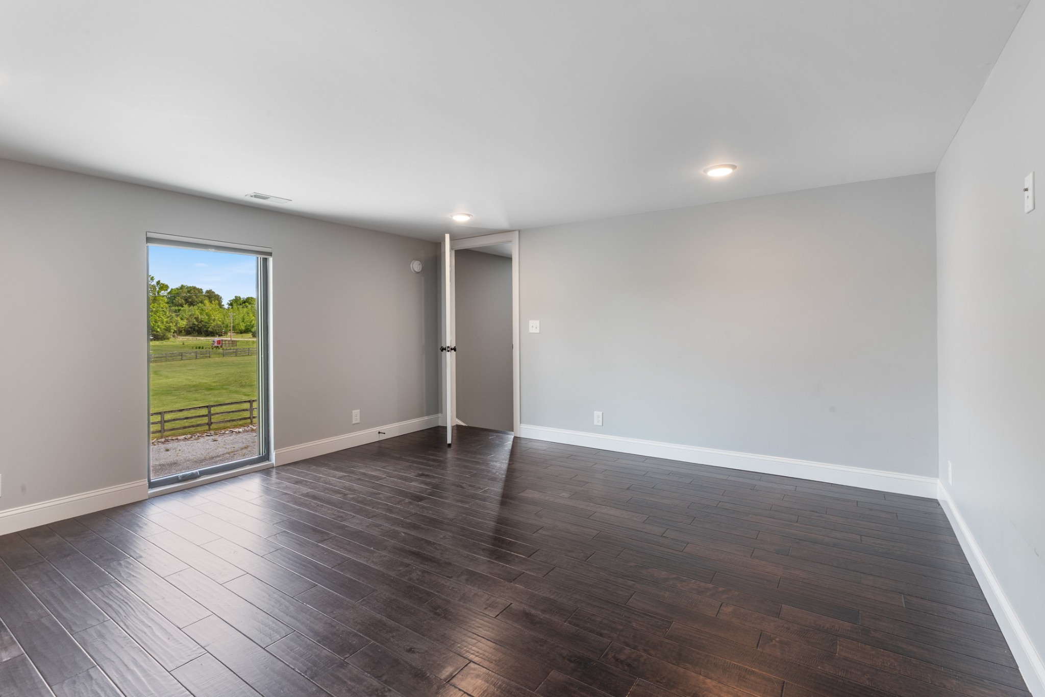 3791 Sylvia Road Dickson, TN 37055 - Photo 47 of 82 an empty room with wooden floor and a window