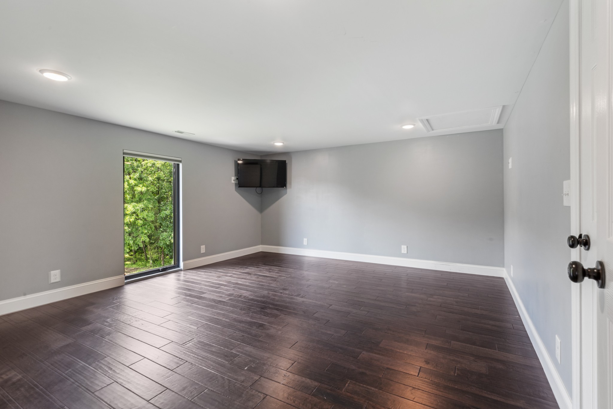 3791 Sylvia Road Dickson, TN 37055 - Photo 48 of 82 an empty room with wooden floor and windows
