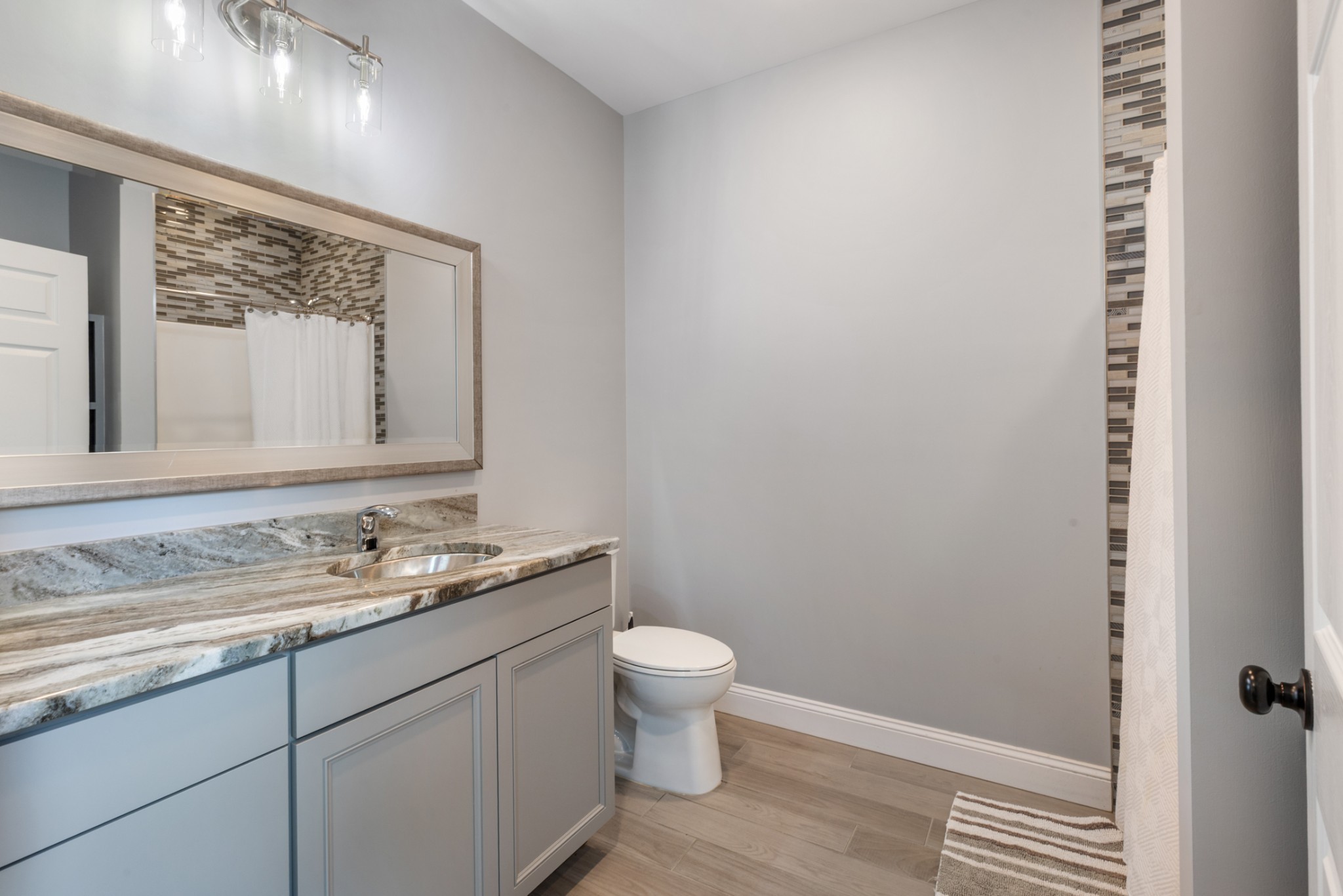3791 Sylvia Road Dickson, TN 37055 - Photo 50 of 82 a bathroom with a granite countertop sink toilet and mirror
