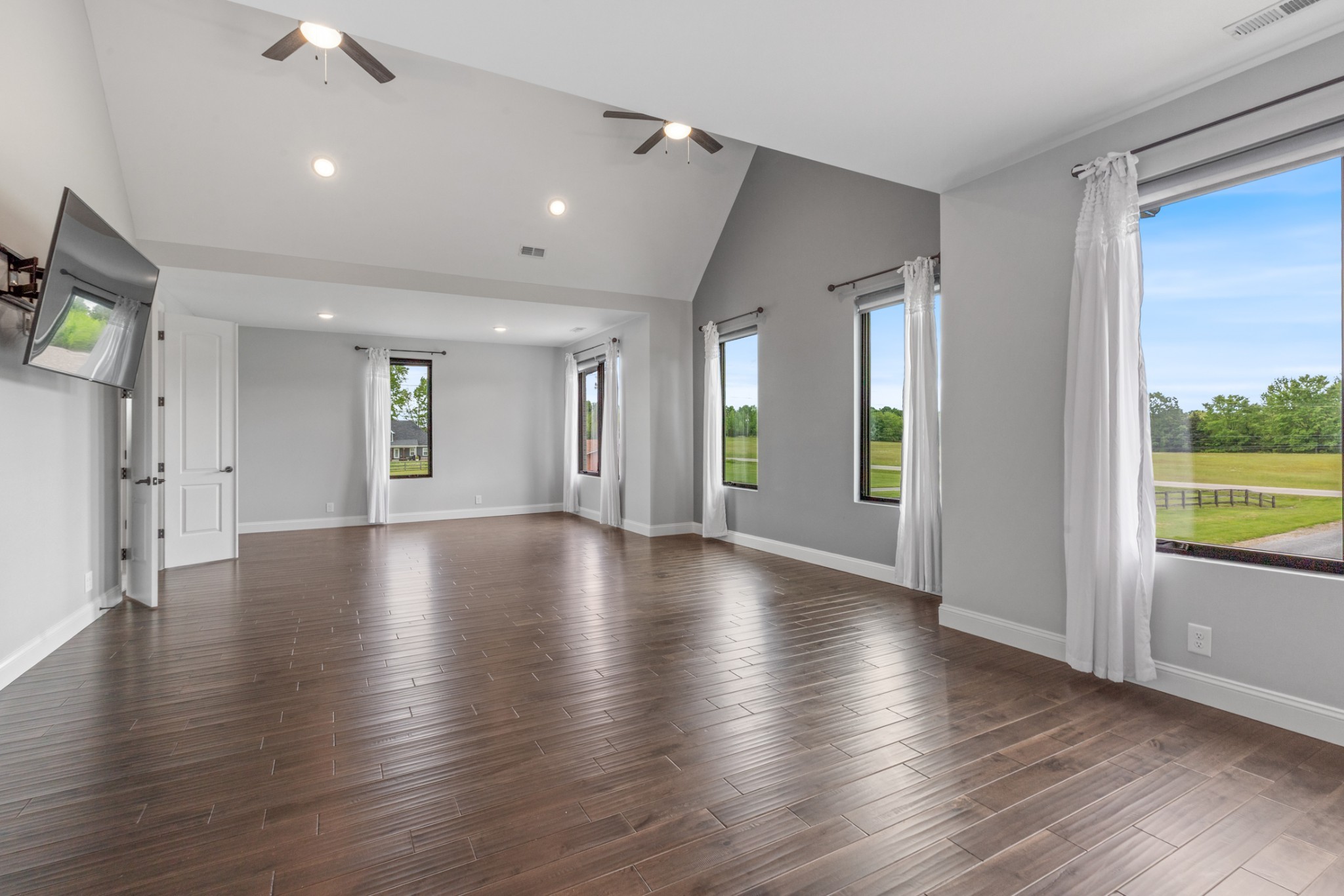 3791 Sylvia Road Dickson, TN 37055 - Photo 7 of 82 an empty room with wooden floor and windows