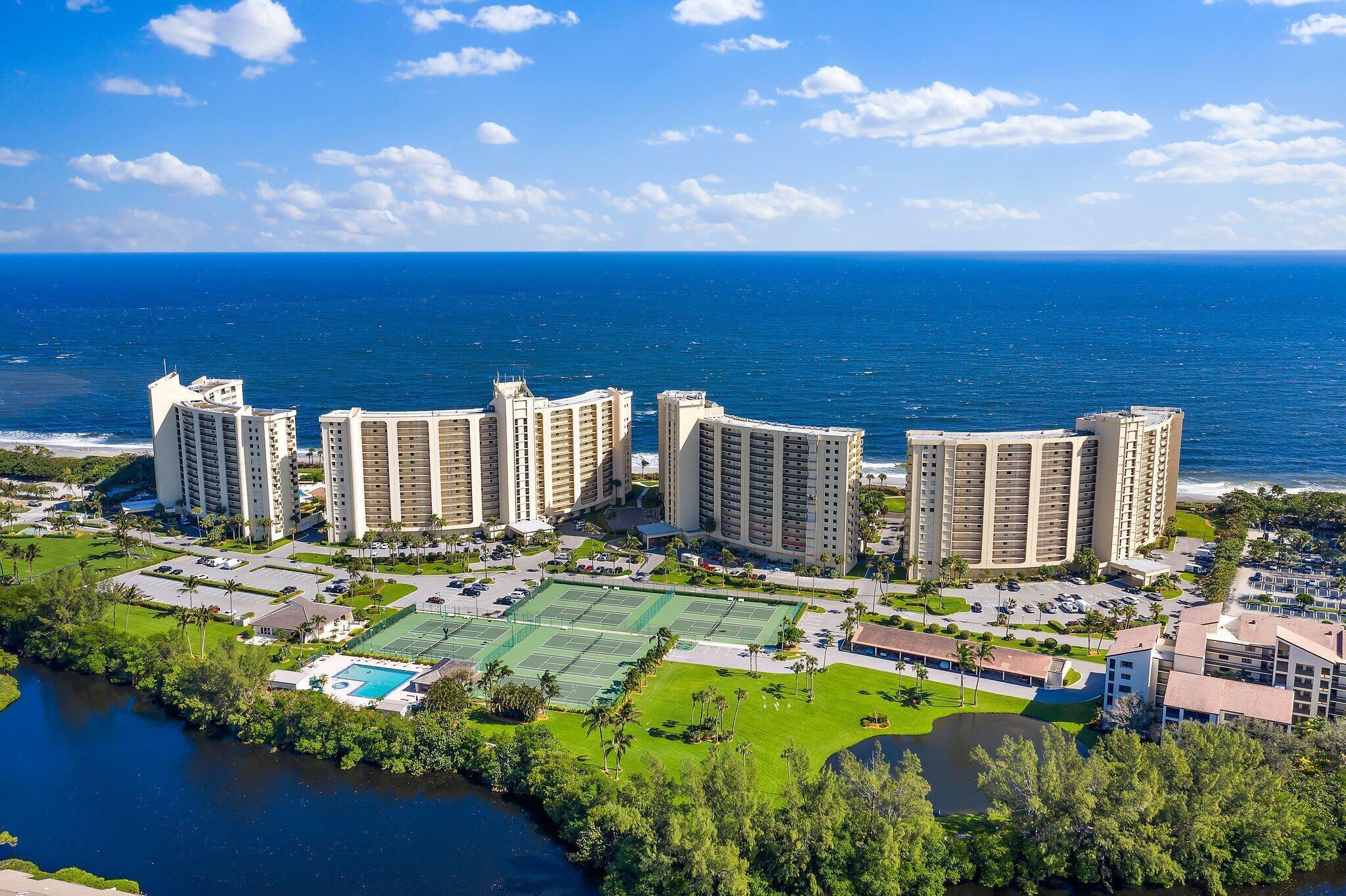 100 Ocean Trail Way, Unit 609 Jupiter, FL 33477 - Photo 46 of 66 a view of a city with lawn chairs