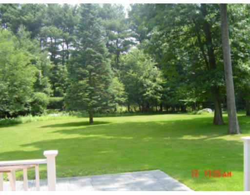 8 Beaver Road Weston, MA 02493 - Photo 4 of 10 a view of a golf course with a garden