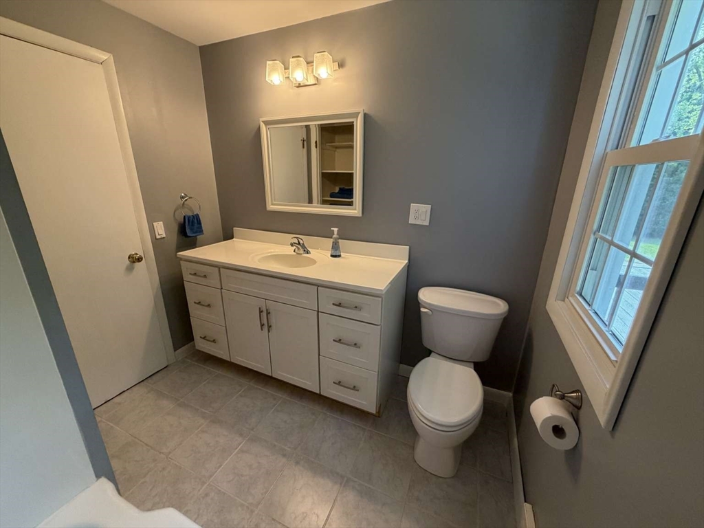 74 Birch Road Longmeadow, MA 01106 - Photo 19 of 38 a bathroom with a toilet sink and mirror