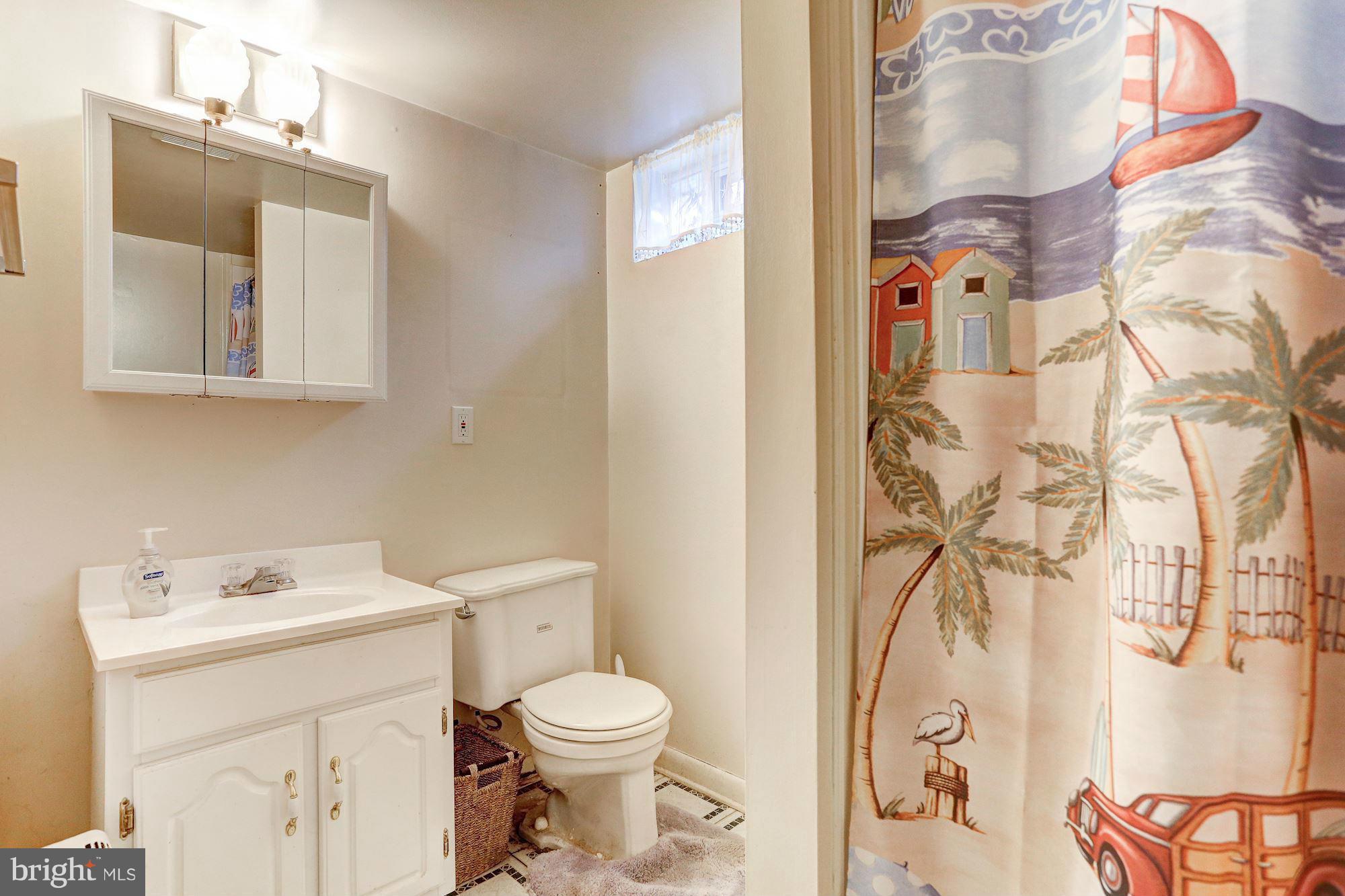 402 North Rolling Road Catonsville, MD 21228 - Photo 14 of 17 a bathroom with a sink and a toilet