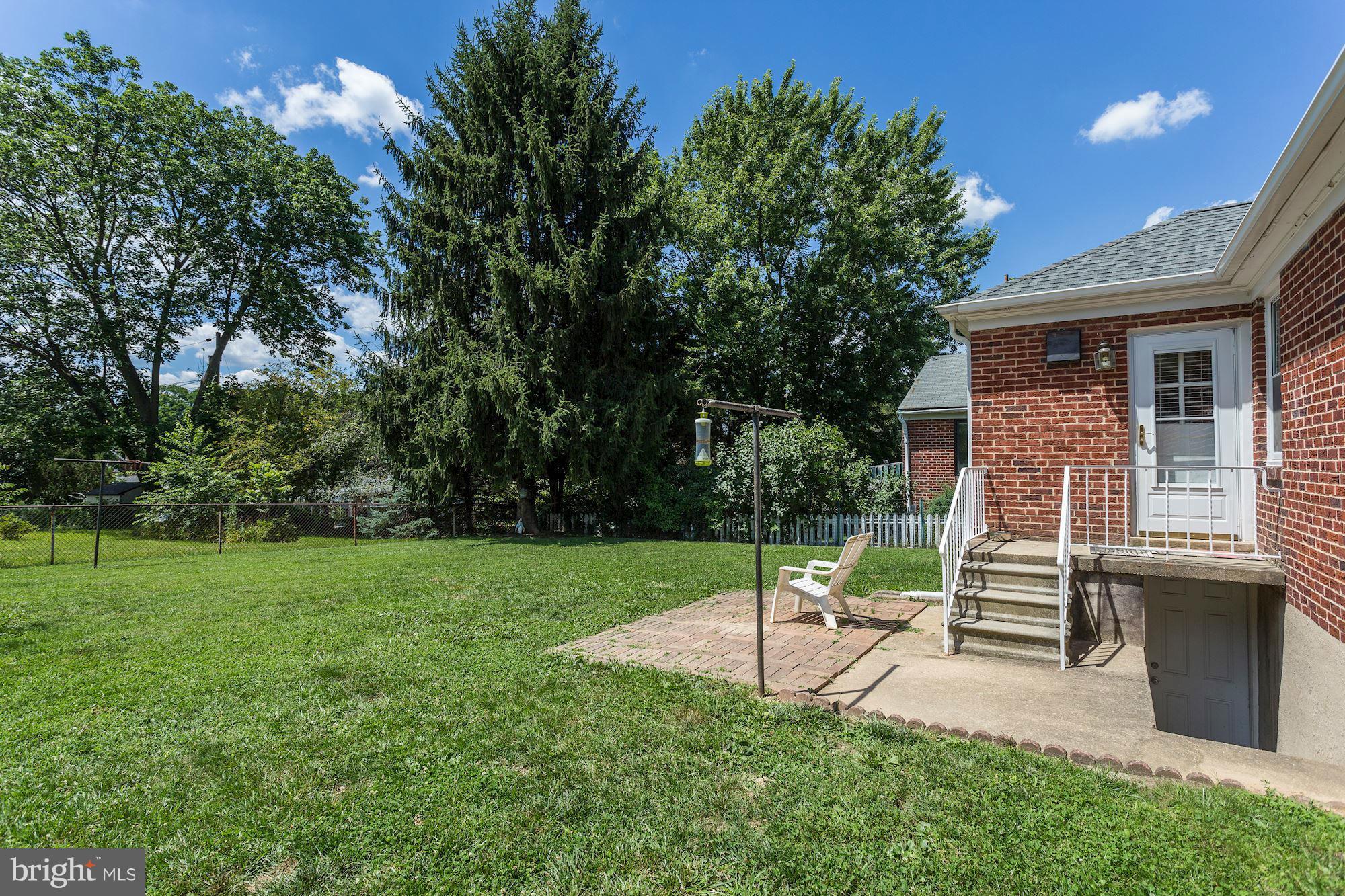402 North Rolling Road Catonsville, MD 21228 - Photo 15 of 17 a house view with a sitting space and garden