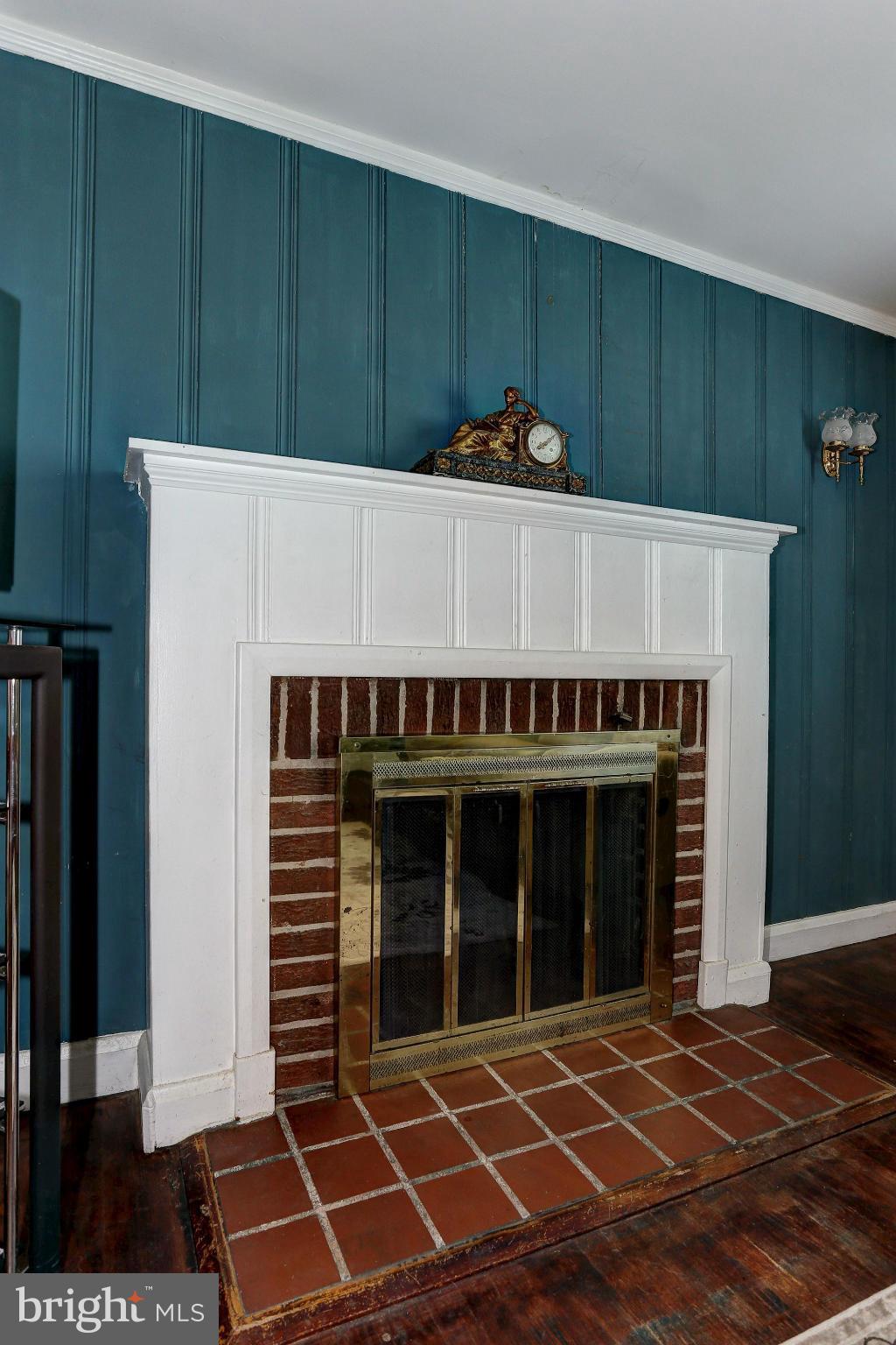 402 North Rolling Road Catonsville, MD 21228 - Photo 4 of 17 a view of a room with wooden floor and a fireplace