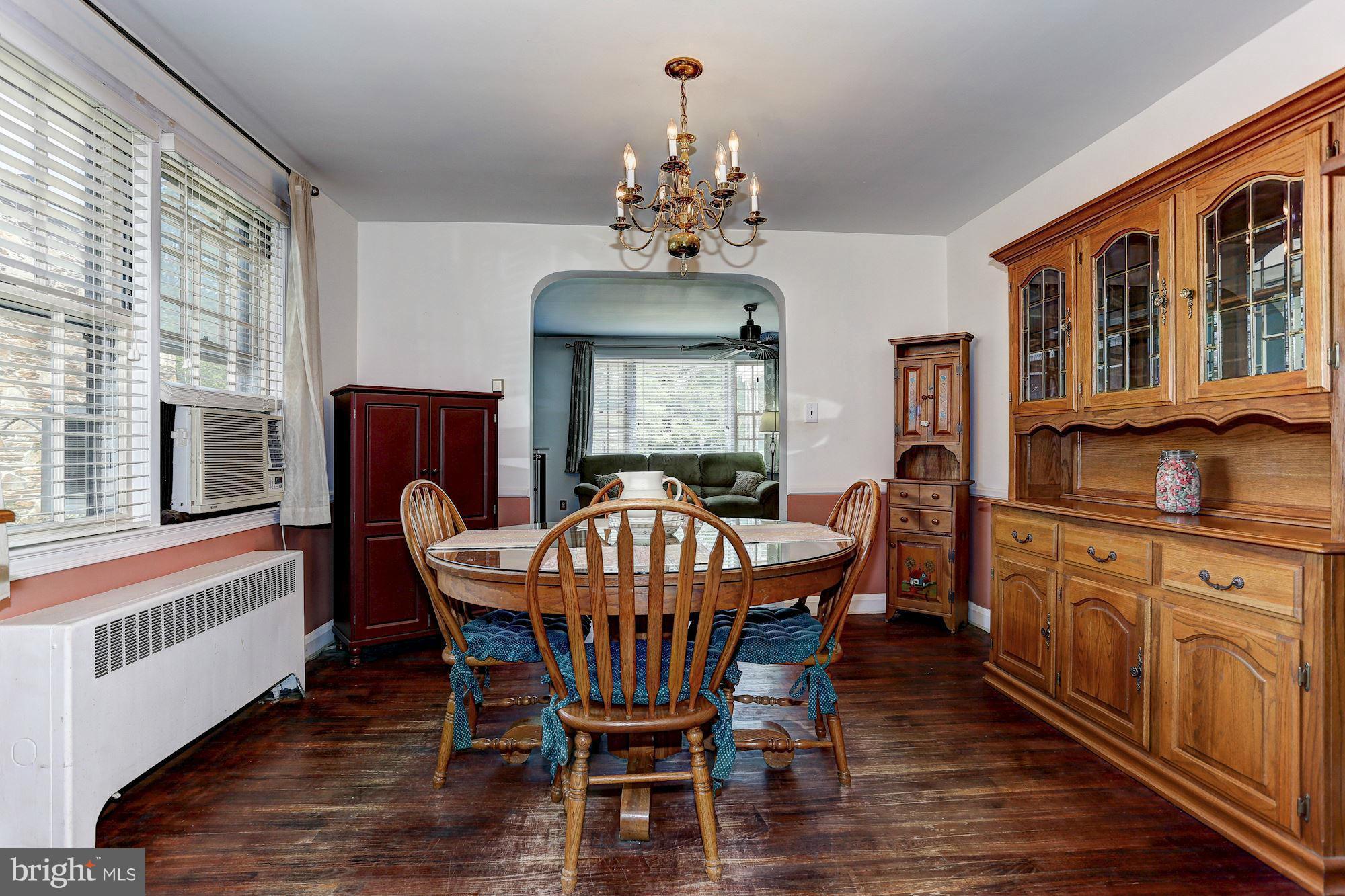 402 North Rolling Road Catonsville, MD 21228 - Photo 5 of 17 a view of a dining room with furniture window and wooden floor