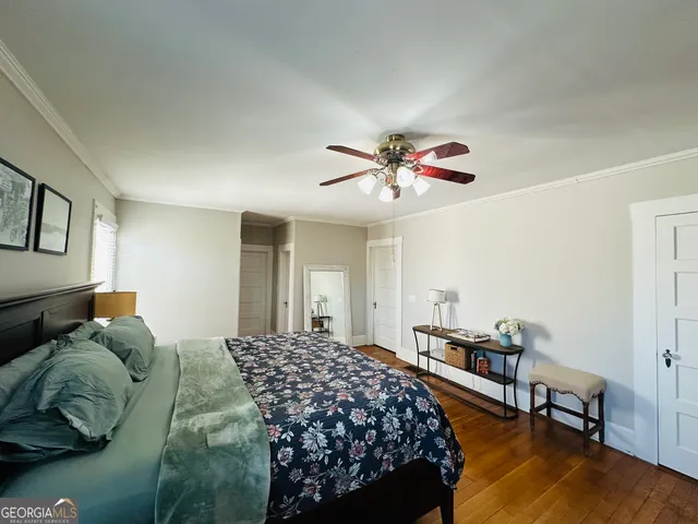 a living room with a fireplace and a wooden floor