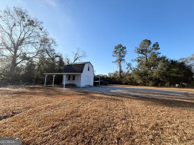 a outdoor dining space with furniture and outdoor view