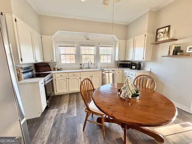 a view of a workspace with furniture