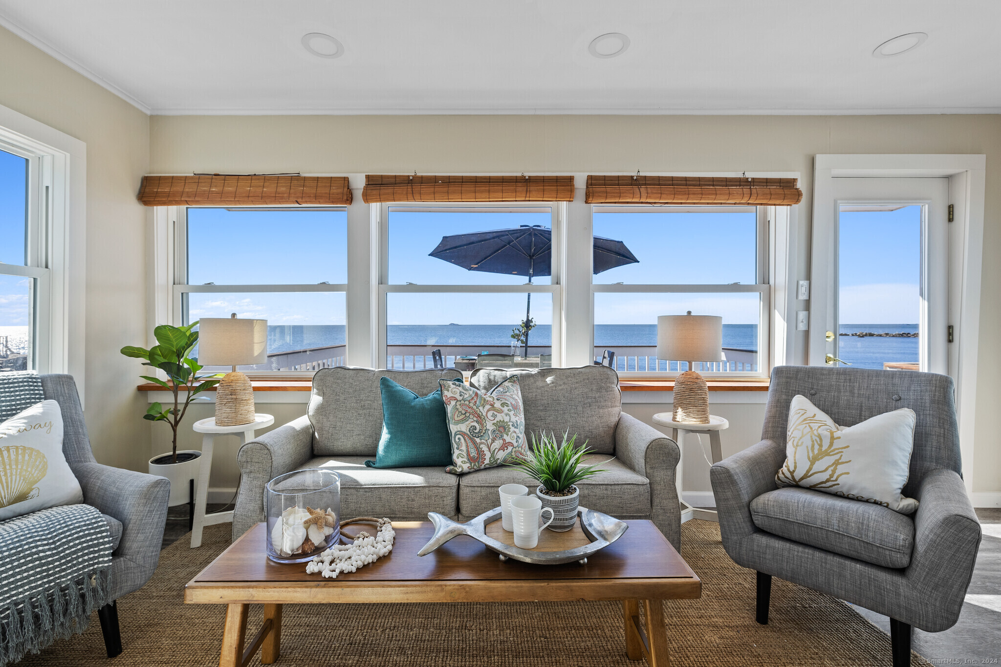 WELCOME TO YOUR BEACH HOUSE! Direct waterfront on a sandy beach with your own private dock on the adjacent parcel.