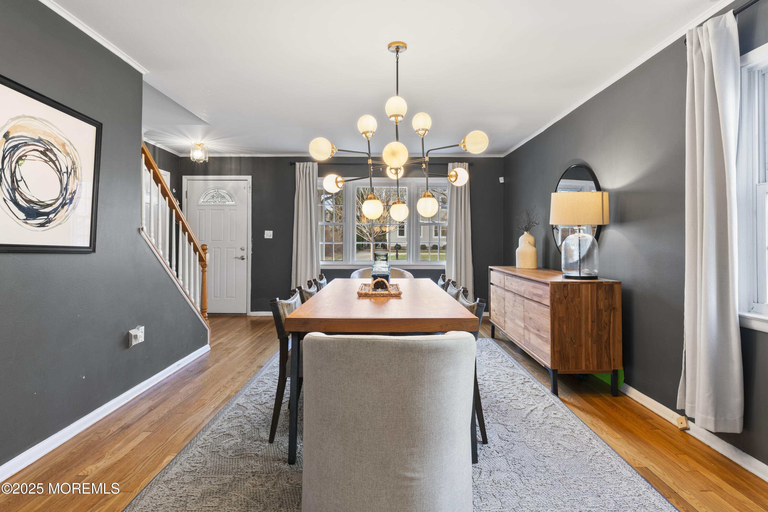 90 River Road Rumson, NJ 07760 - Photo 11 of 32 a very nice looking dining room with a large bed and a chandelier