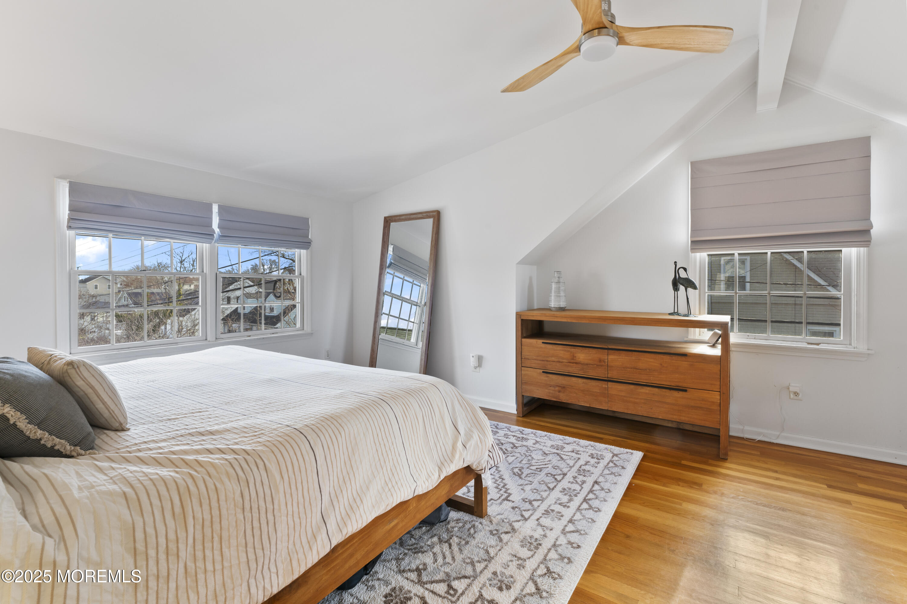 90 River Road Rumson, NJ 07760 - Photo 13 of 32 a bedroom with a bed and a window