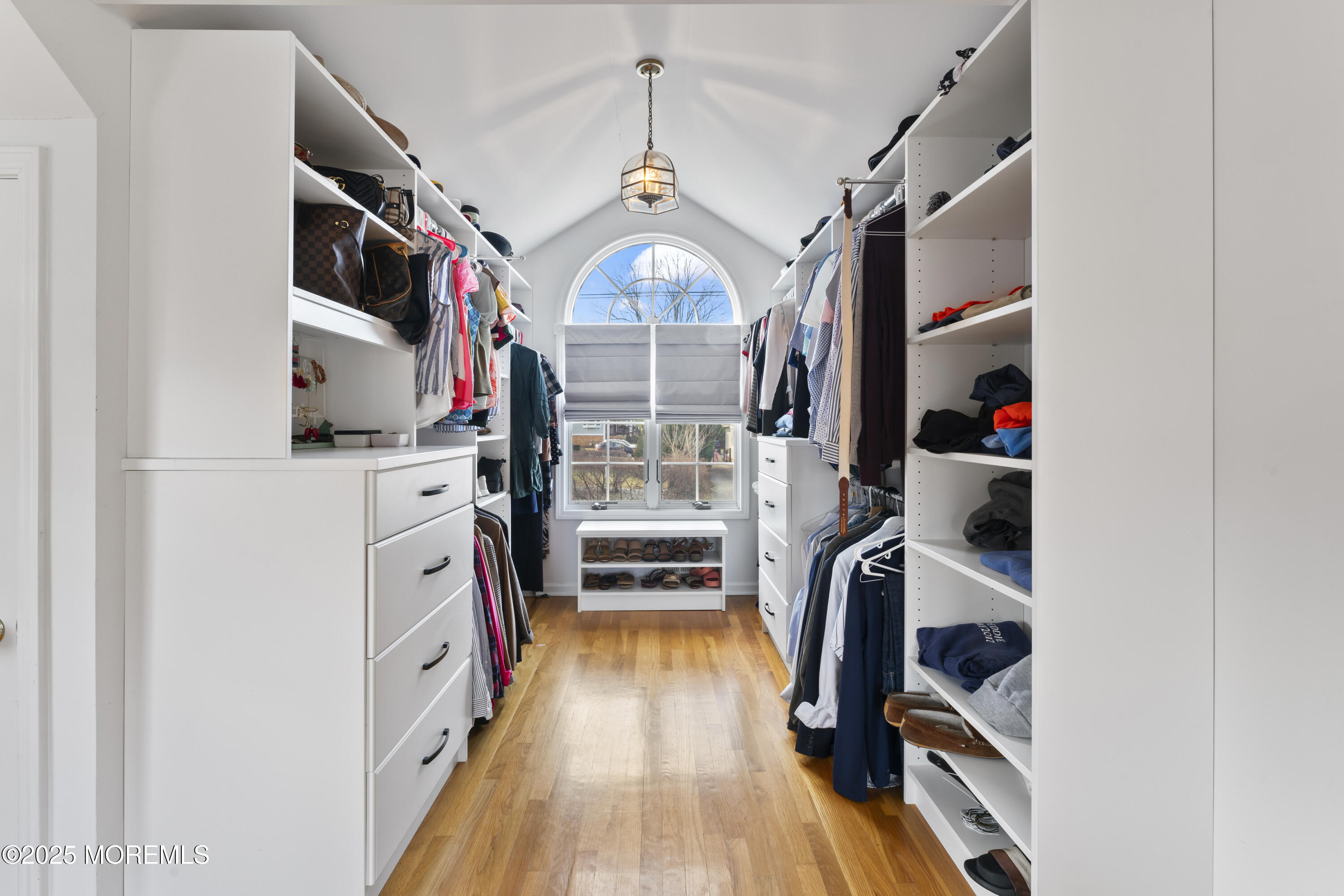 90 River Road Rumson, NJ 07760 - Photo 15 of 32 a view of walk in closet with clothes and shoes